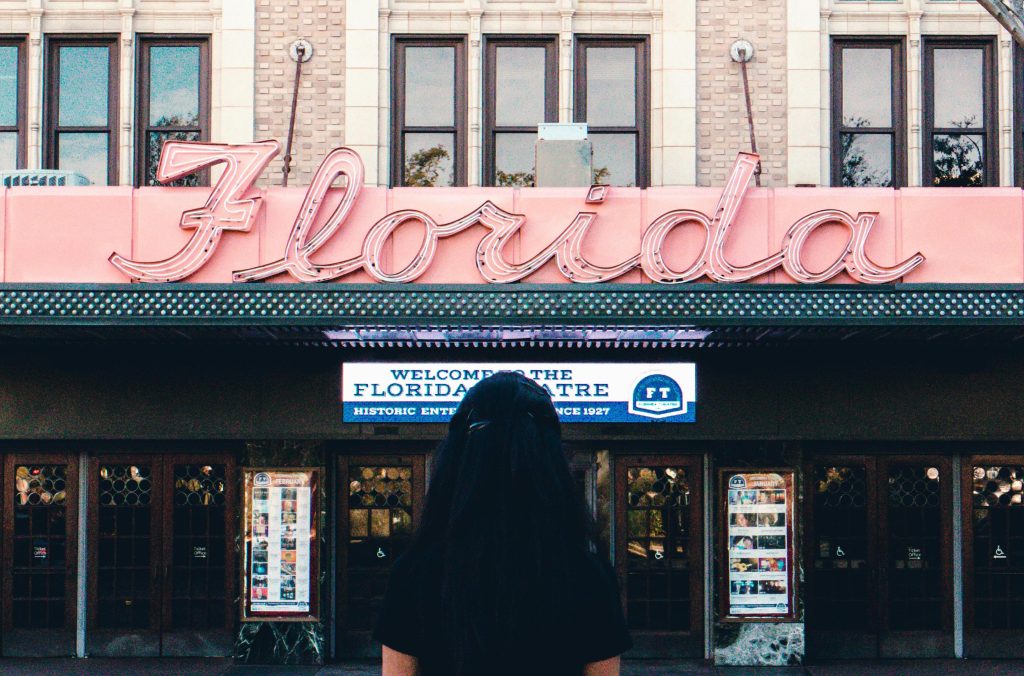 woman looking at florida sign
